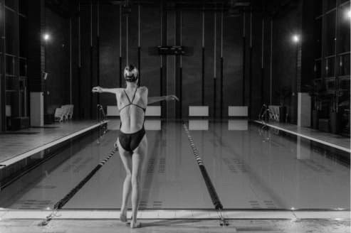 Swimmer performing flexibility and stretching exercises